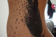 black-big-feather-tattoo